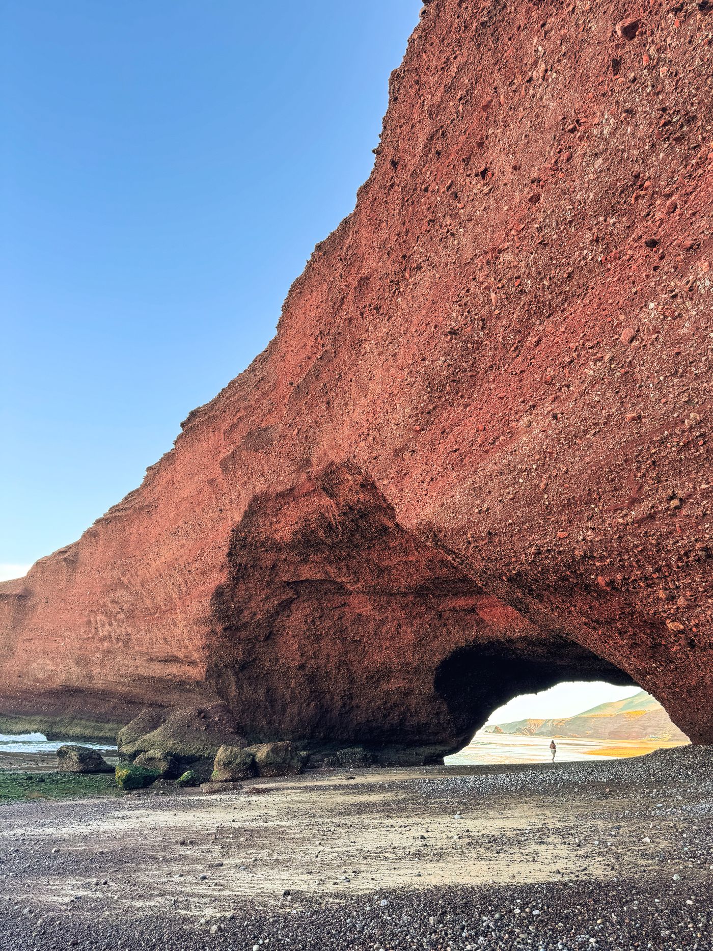 Legzira, Morocco — Walk beneath the red cliff arches of Legzira Beach