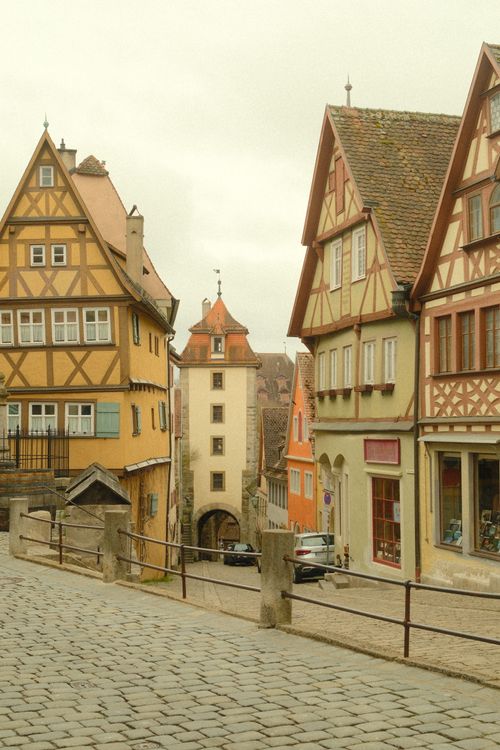 Free Picturesque street scene in Rothenburg ob der Tauber, featuring medieval architecture and vibrant colors. Stock Photo