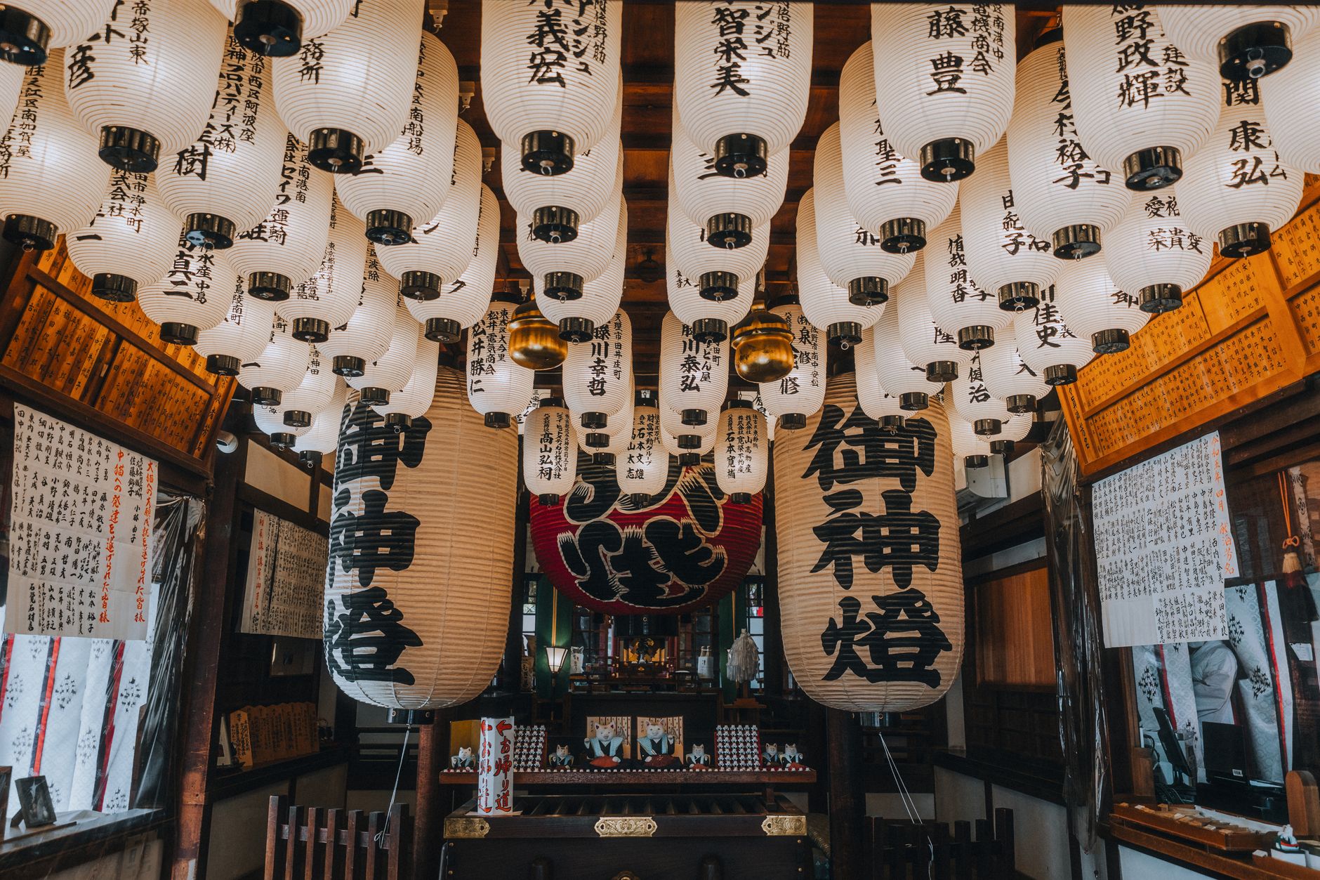 Intricate display of Japanese lanterns at a shrine in Osaka, Japan, showcasing cultural heritage.
