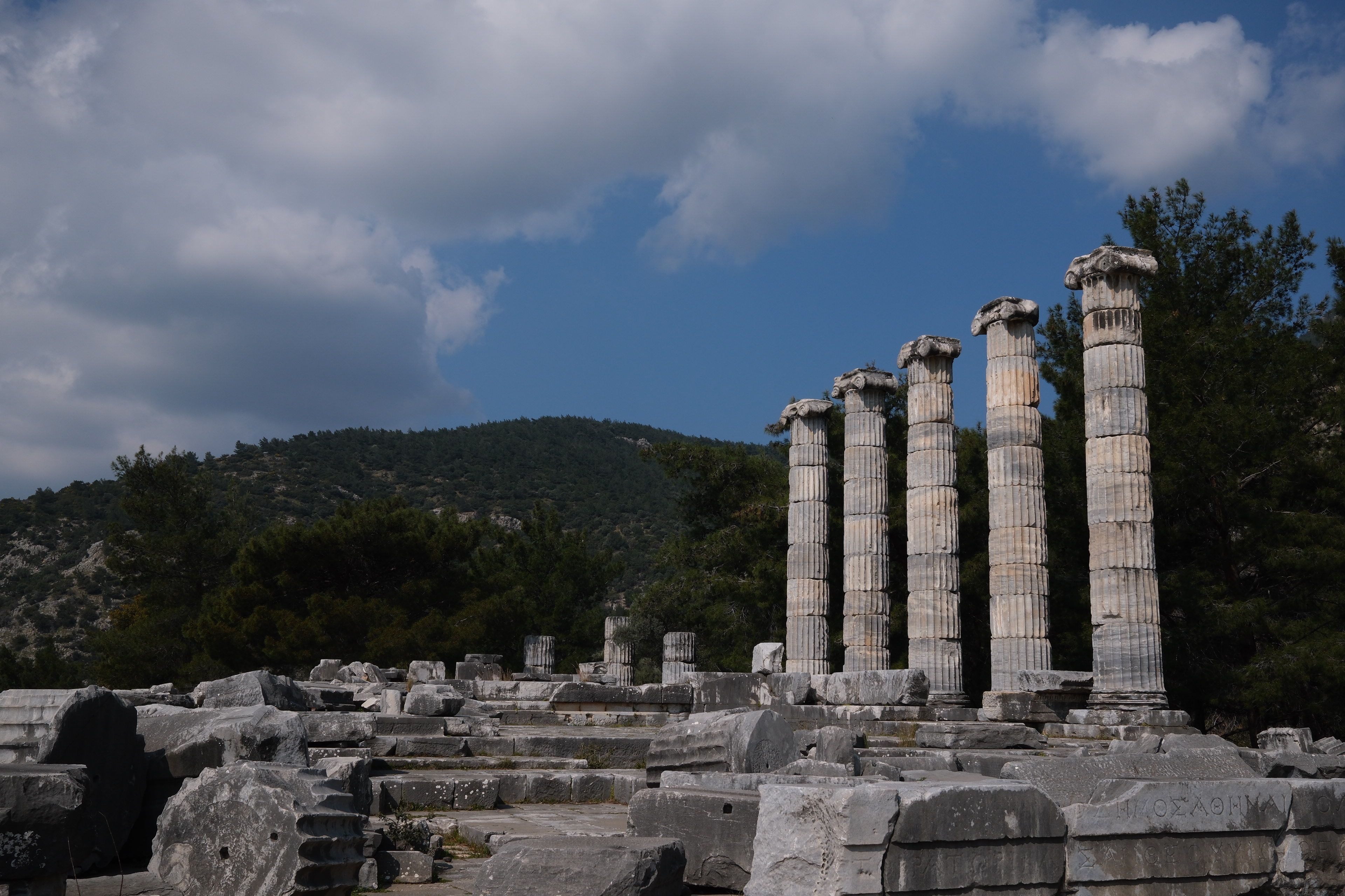 Ancient Temple of Athena ruins at Priene archaeological site at golden hour, Aydın, Turkey, Hellenistic city with Mount Mycale backdrop