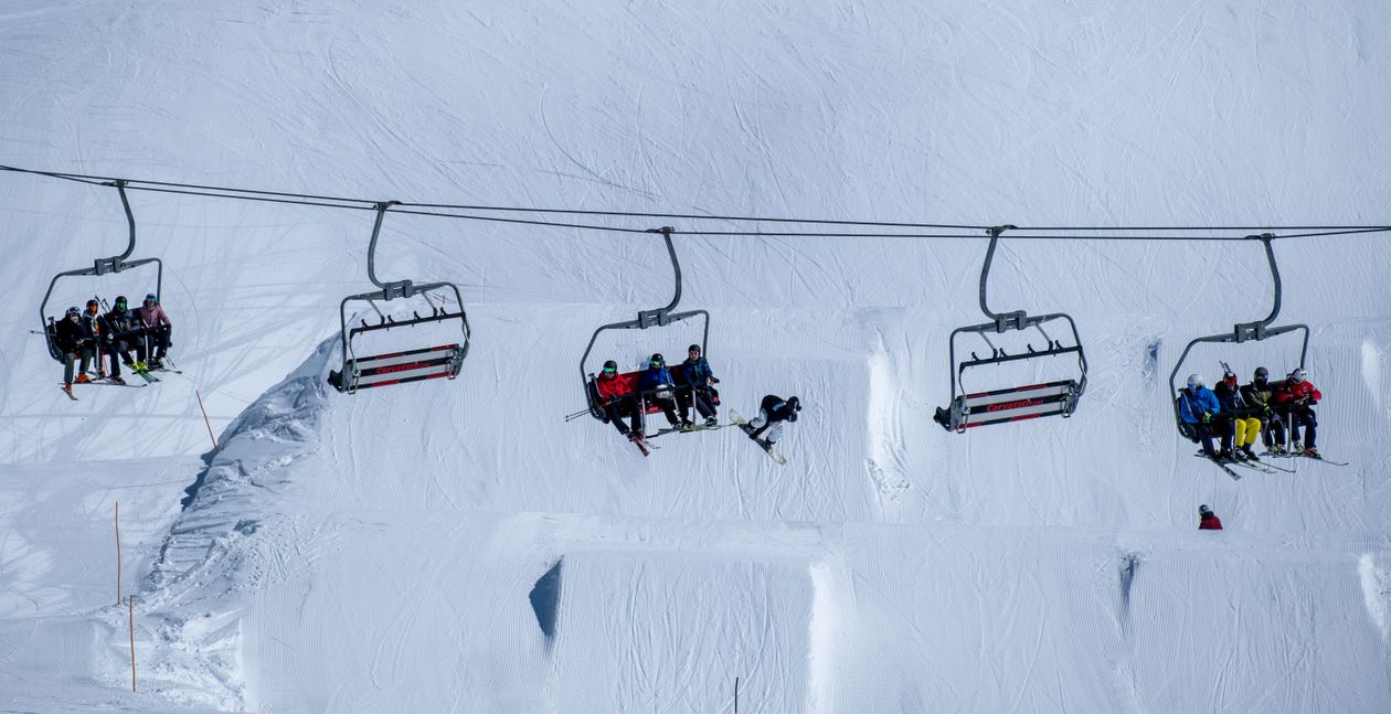 Skiers and Snowboarders Riding Chairlift in Snowy Mountains · Free ...