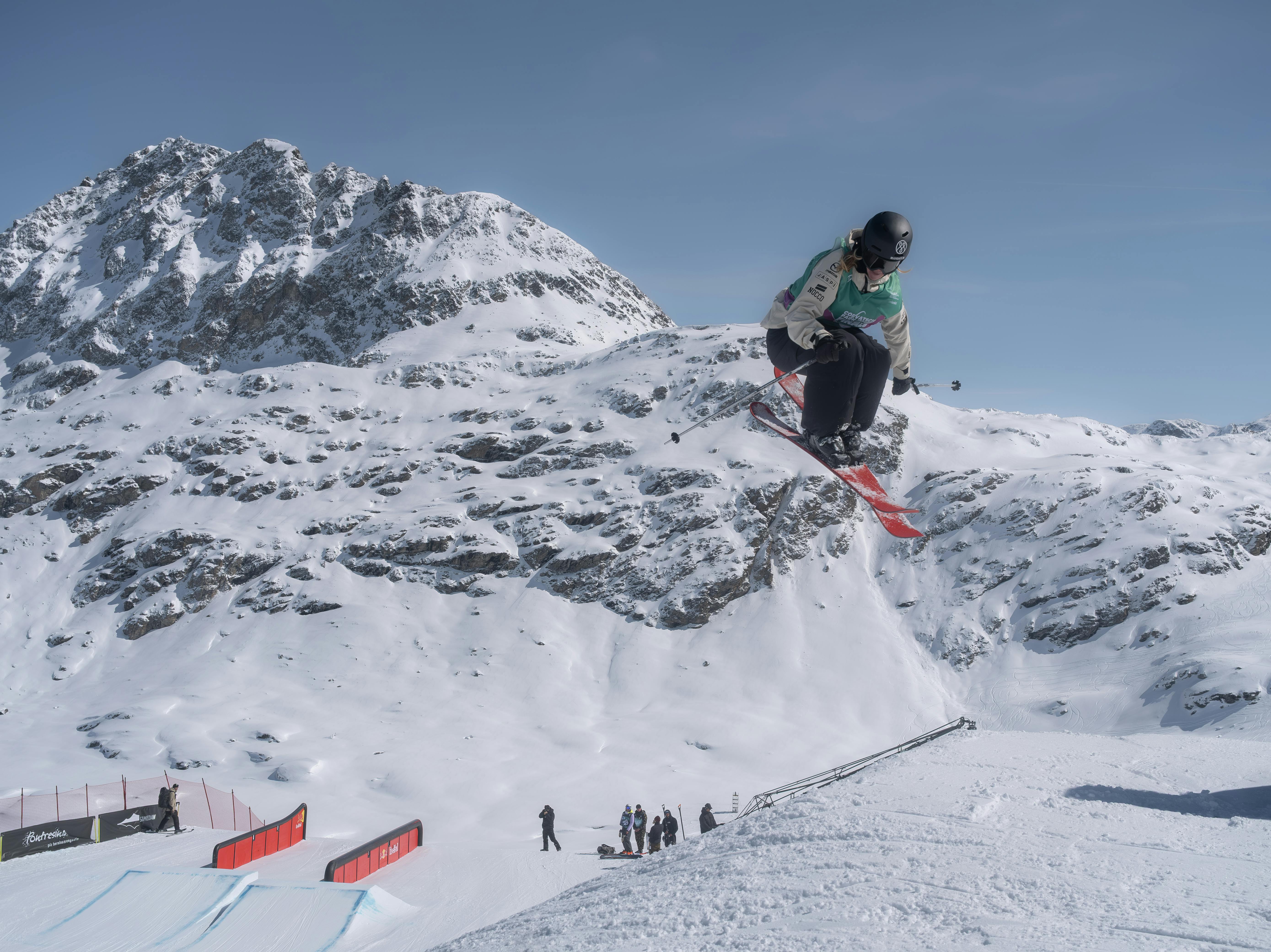 Dynamic shot of an athlete snowboarding in Sils im Engadin/Segl, showcasing thrilling alpine sports.