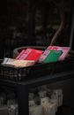 A collection of vibrant magazines displayed in a wicker basket.