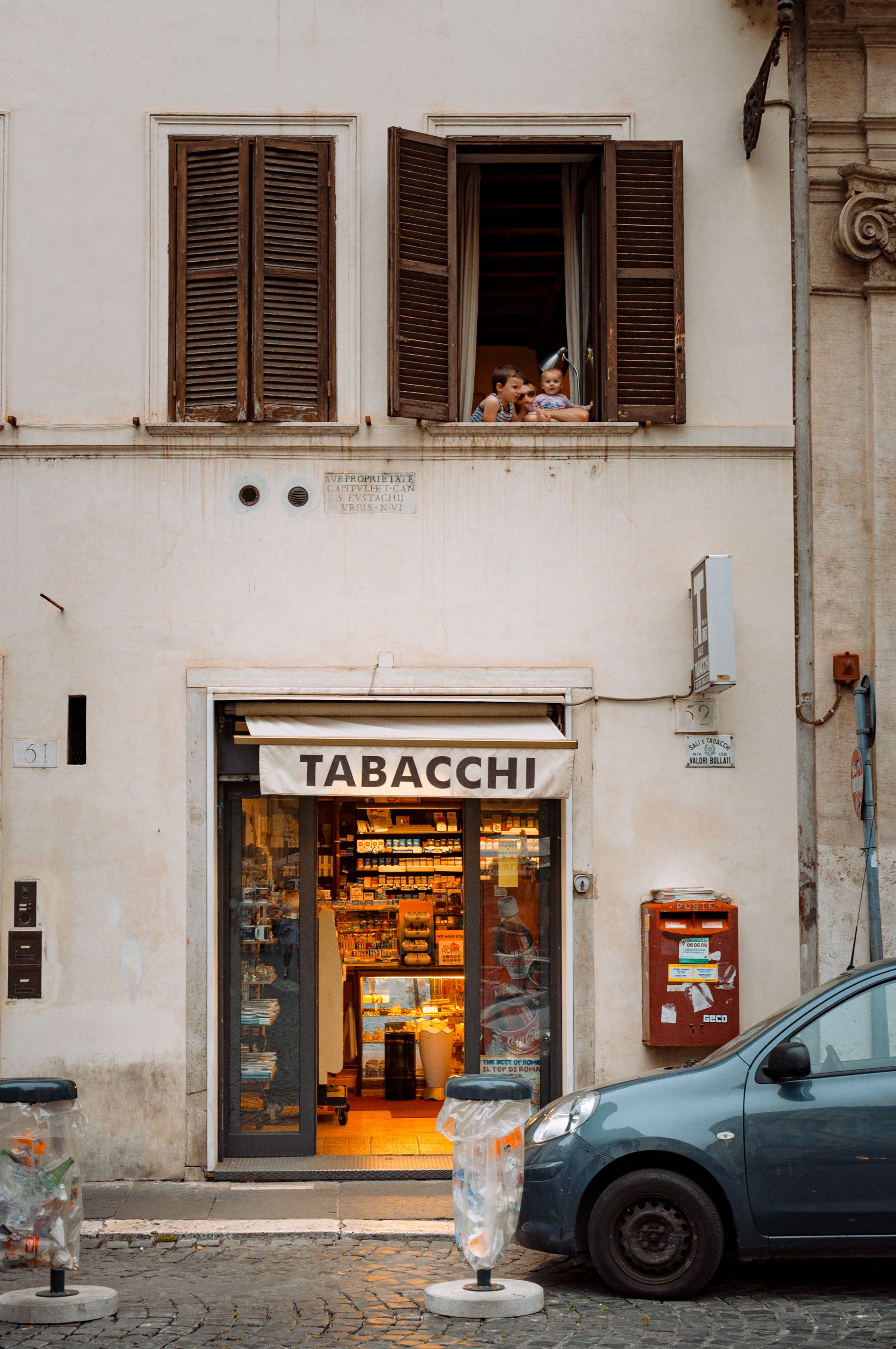 tobacco store rome Tourists in Front of Historic Greek Tobacco Shop · Free Stock Photo