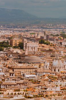 Stunning aerial shot of Rome showcasing its rich historical architecture under a warm light.