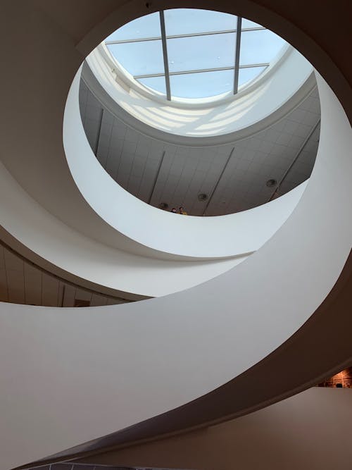 White Concrete Spiral Staircase With Glass Windows