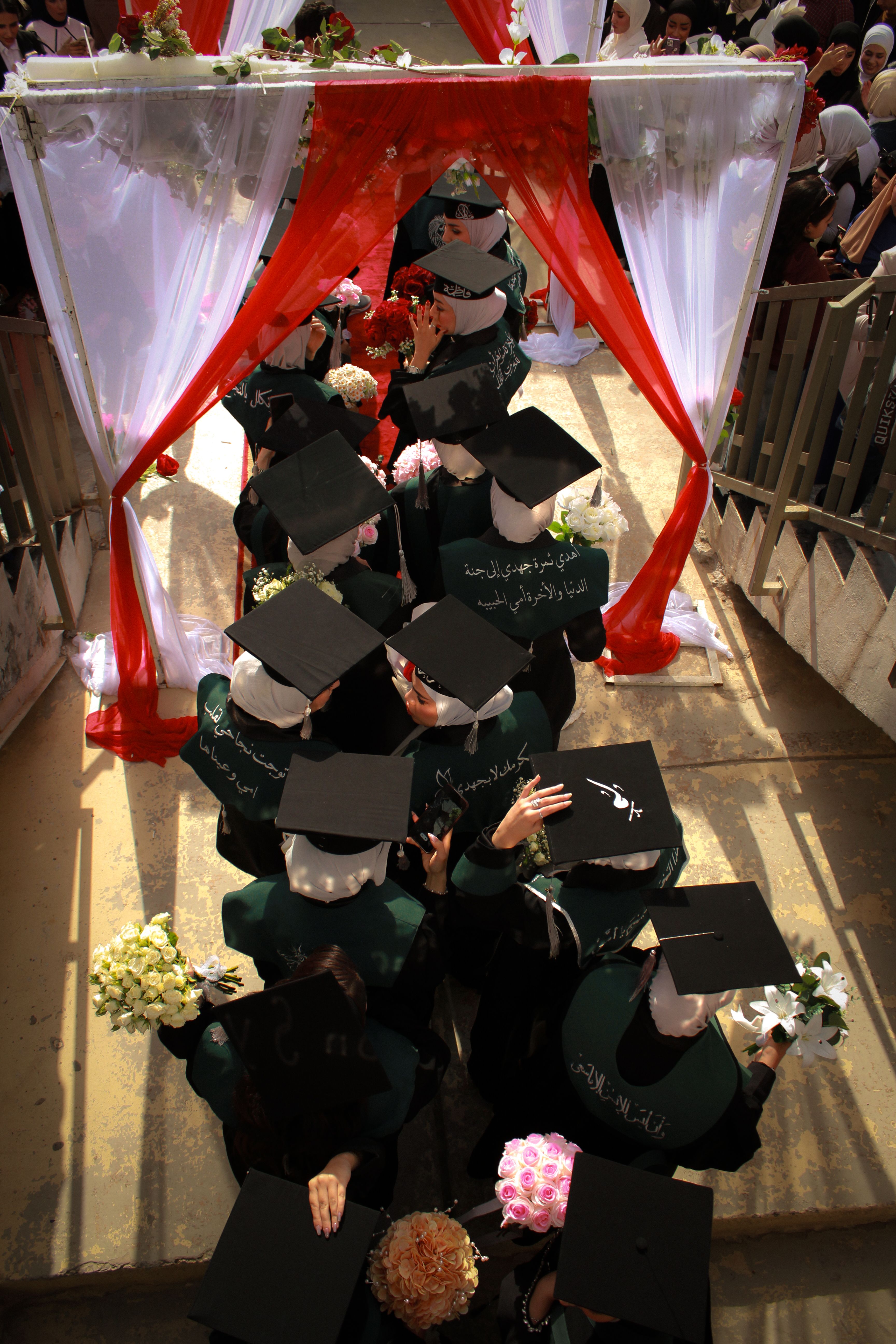 Graduation Ceremony with Students in Cap and Gown · Free Stock Photo