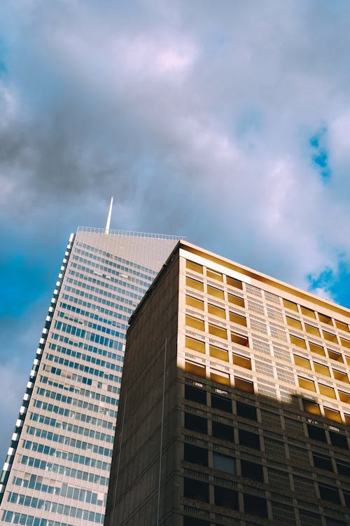 Free Low Angle Shot Skyscraper and Two Buildings Stock Photo