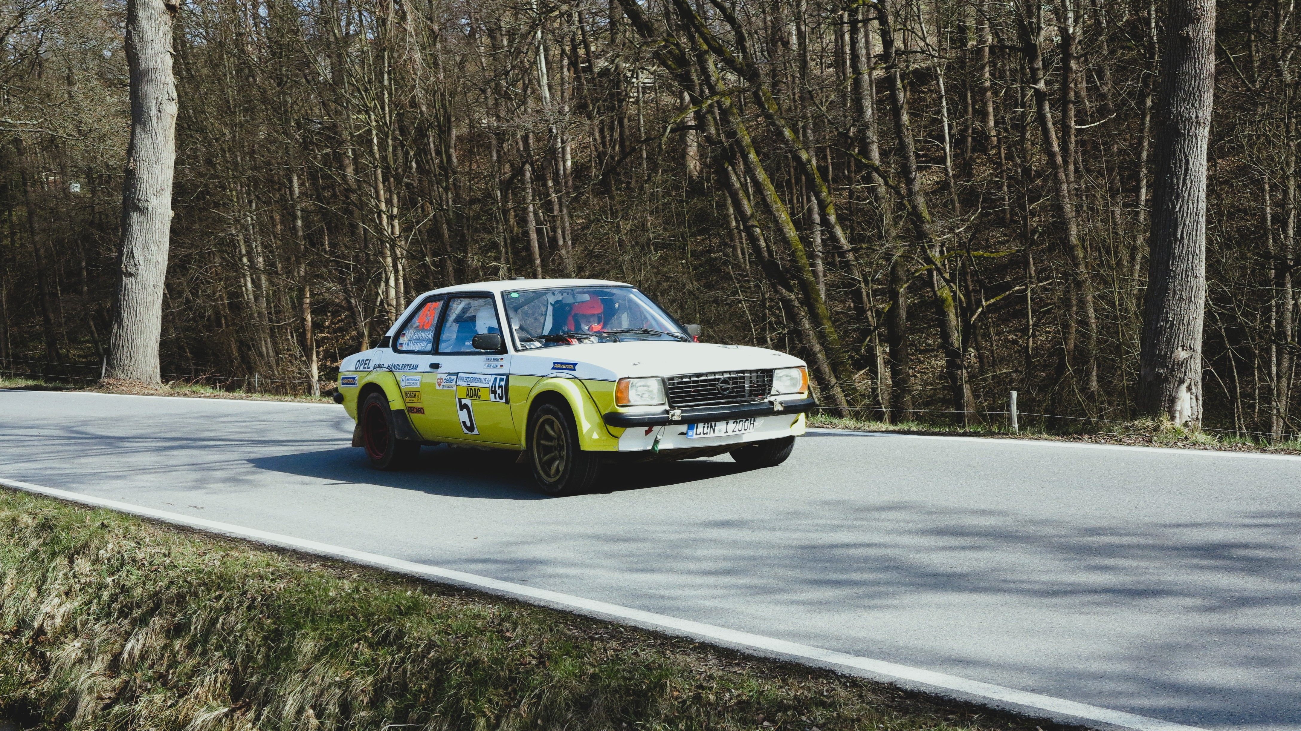 Vintage Rally Car Racing Through Forest Road · Free Stock Photo