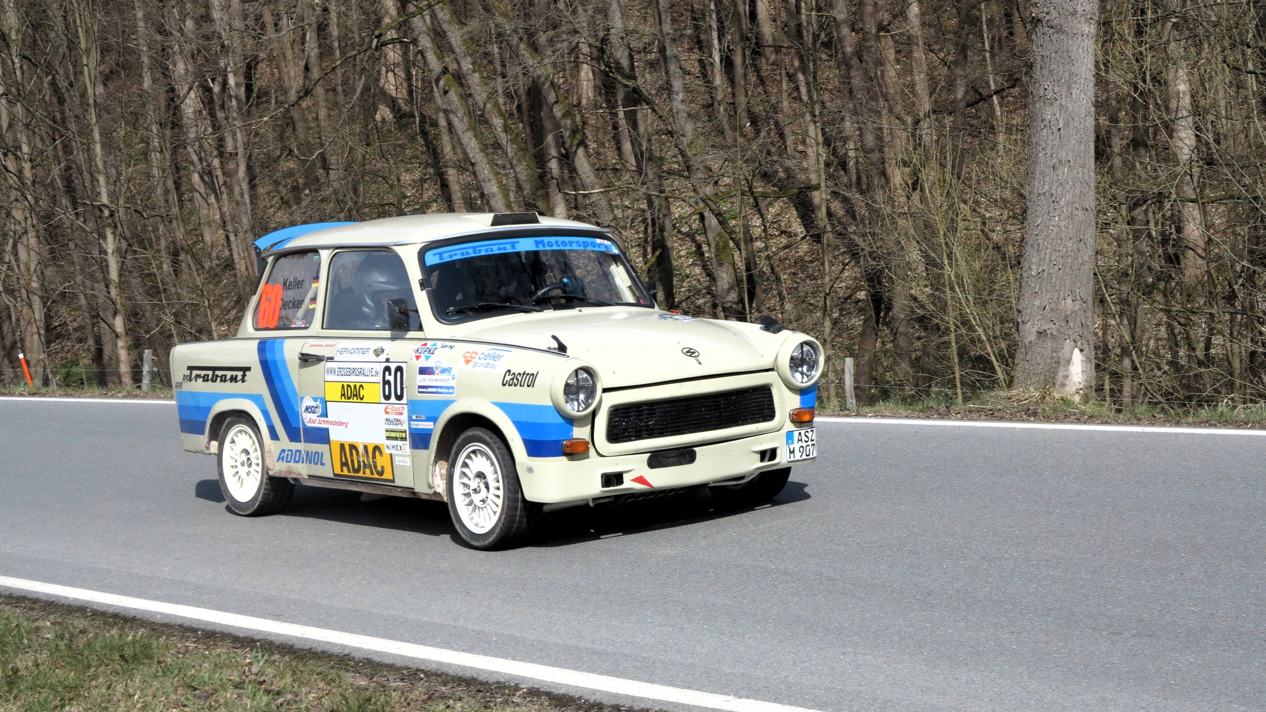 Vintage Blue Rally Car Racing on Curvy Road · Free Stock Photo