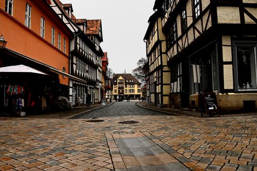Free Historic European street with half-timbered houses under an overcast sky, capturing old-world charm. Stock Photo