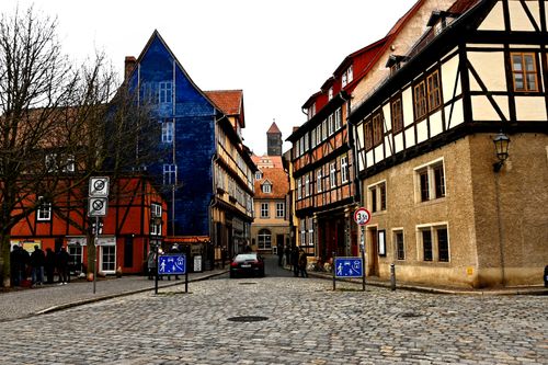 Free Charming street with colorful half-timbered houses in a historic European town, showcasing traditional architecture. Stock Photo
