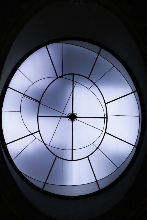 Free Futuristic circular skylight with geometric design and light patterns. Stock Photo