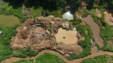 Aerial photo of mining operations in Koidu, Sierra Leone, showcasing land transformation.