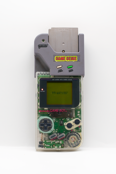 Classic Nintendo Game Boy with Game Genie attachment showcasing retro gaming nostalgia.