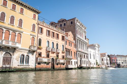 Free Charming Venetian buildings by a canal on a sunny day in Venice, Italy. Stock Photo