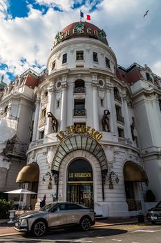 Stunning view of the iconic Le Negresco Hotel in Nice, France, under vibrant blue skies.