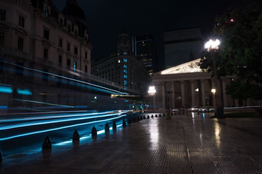 Stunning nighttime view of Buenos Aires featuring dynamic light trails and classic architecture.