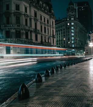 Dynamic nighttime long exposure capturing motion blur of city traffic in Buenos Aires.