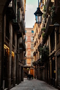 A picturesque narrow street in Barcelona, showcasing classic architecture and vibrant European city life.