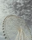 White Ferris Wheel Under Cloudy Sky