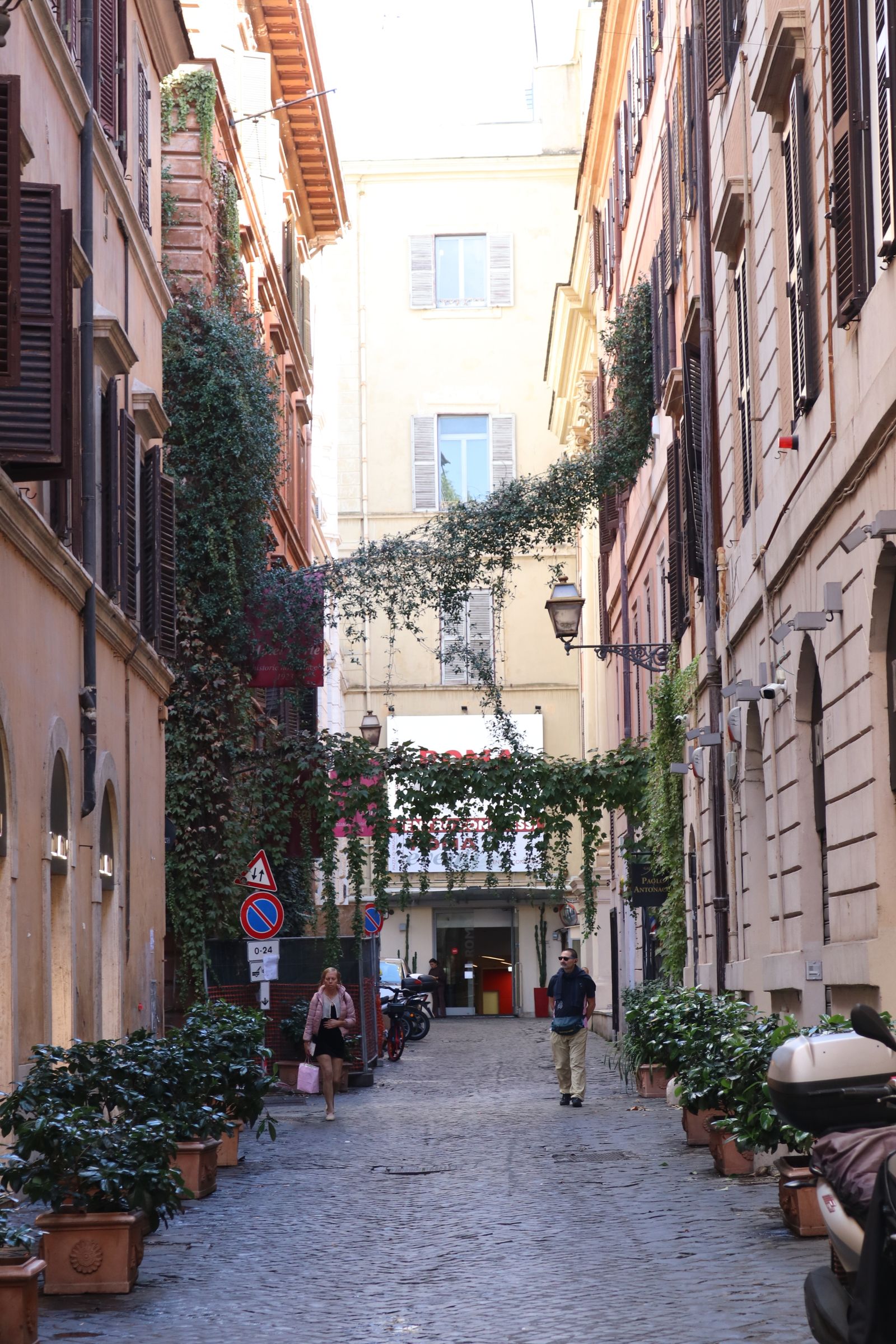 A narrow cobbled Trastevere street in Rome
