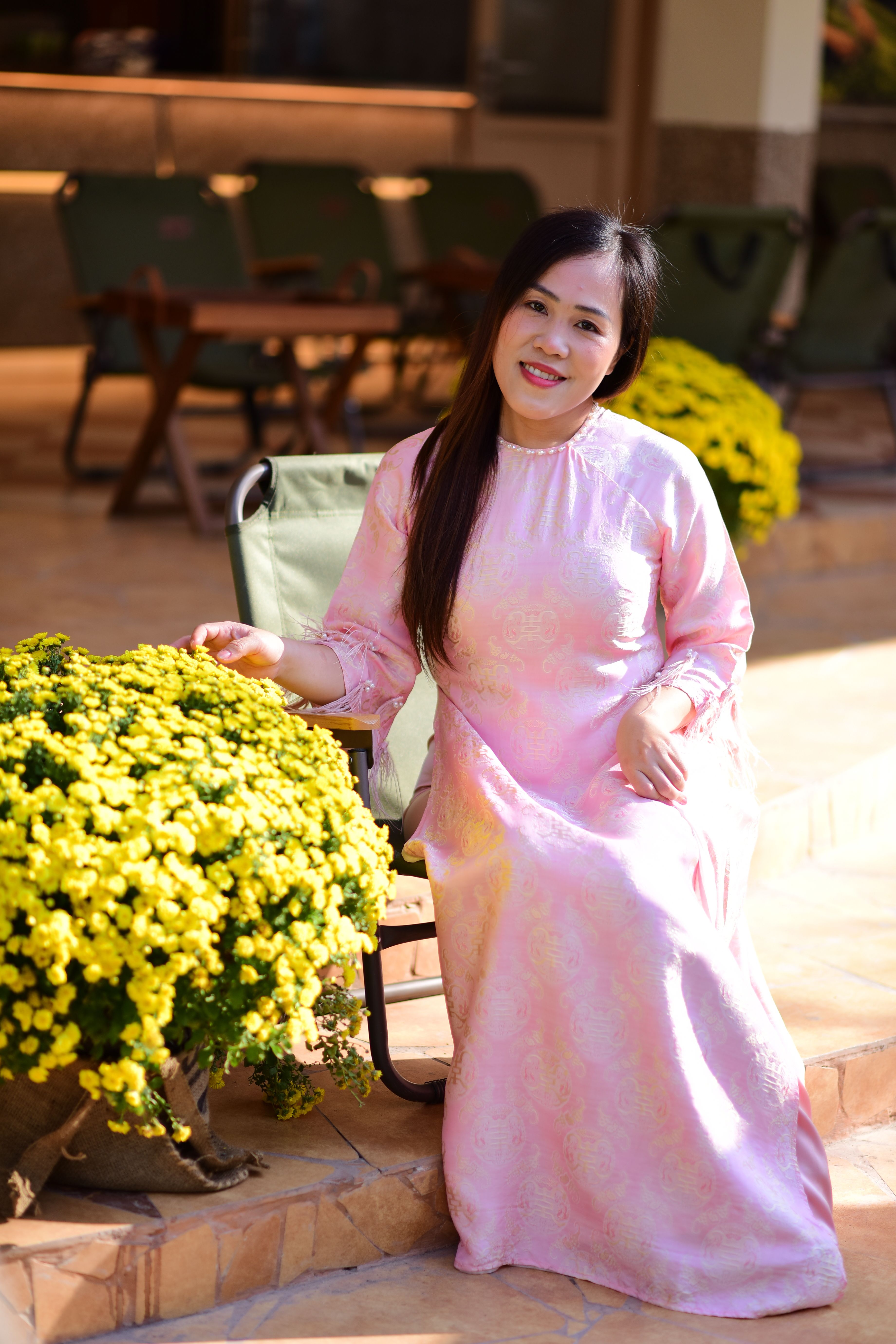 Woman in Traditional Dress with Yellow Flowers · Free Stock Photo
