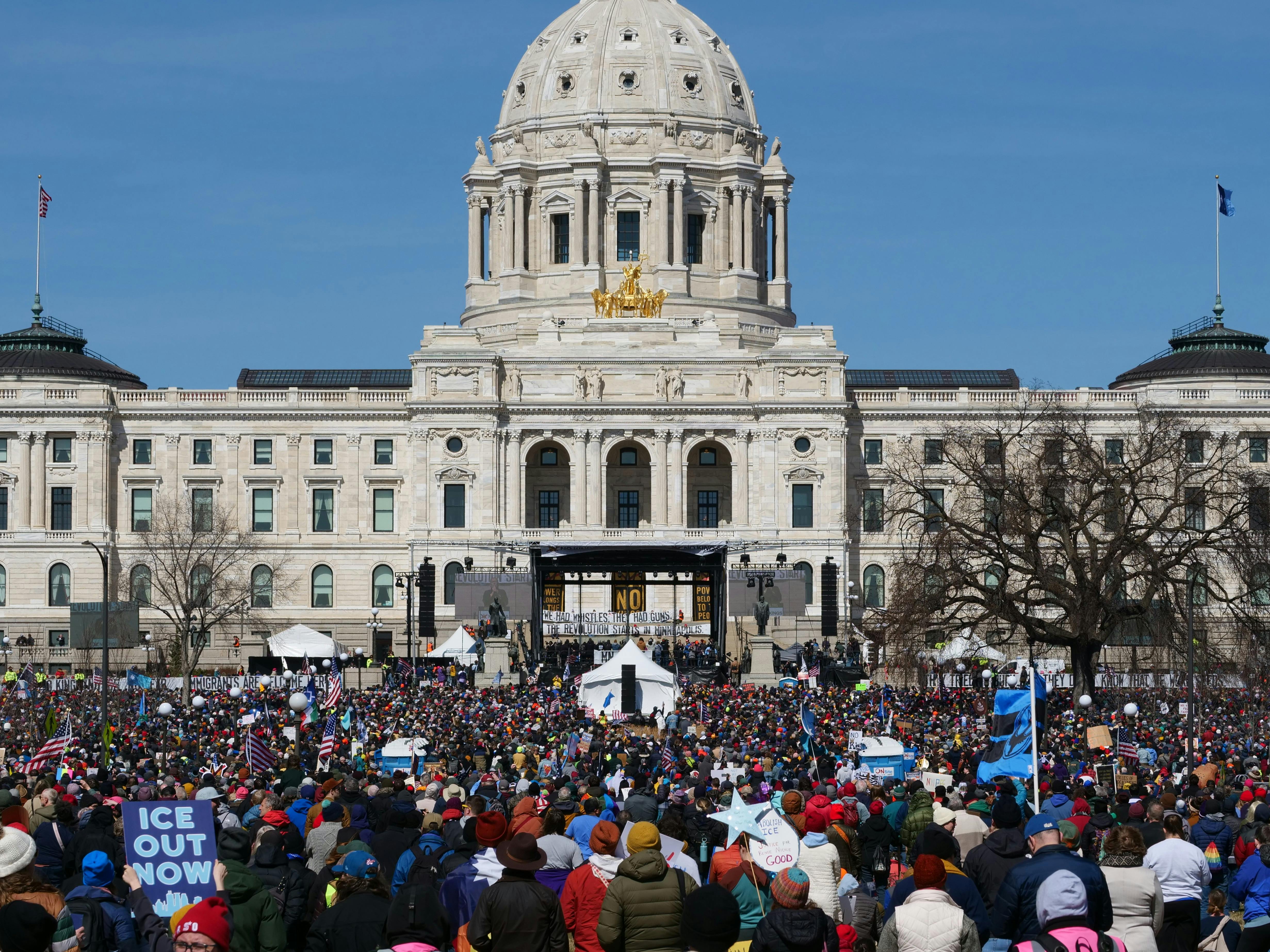 Demonstrators gathered at Minnesota State Capitol advocating for change.