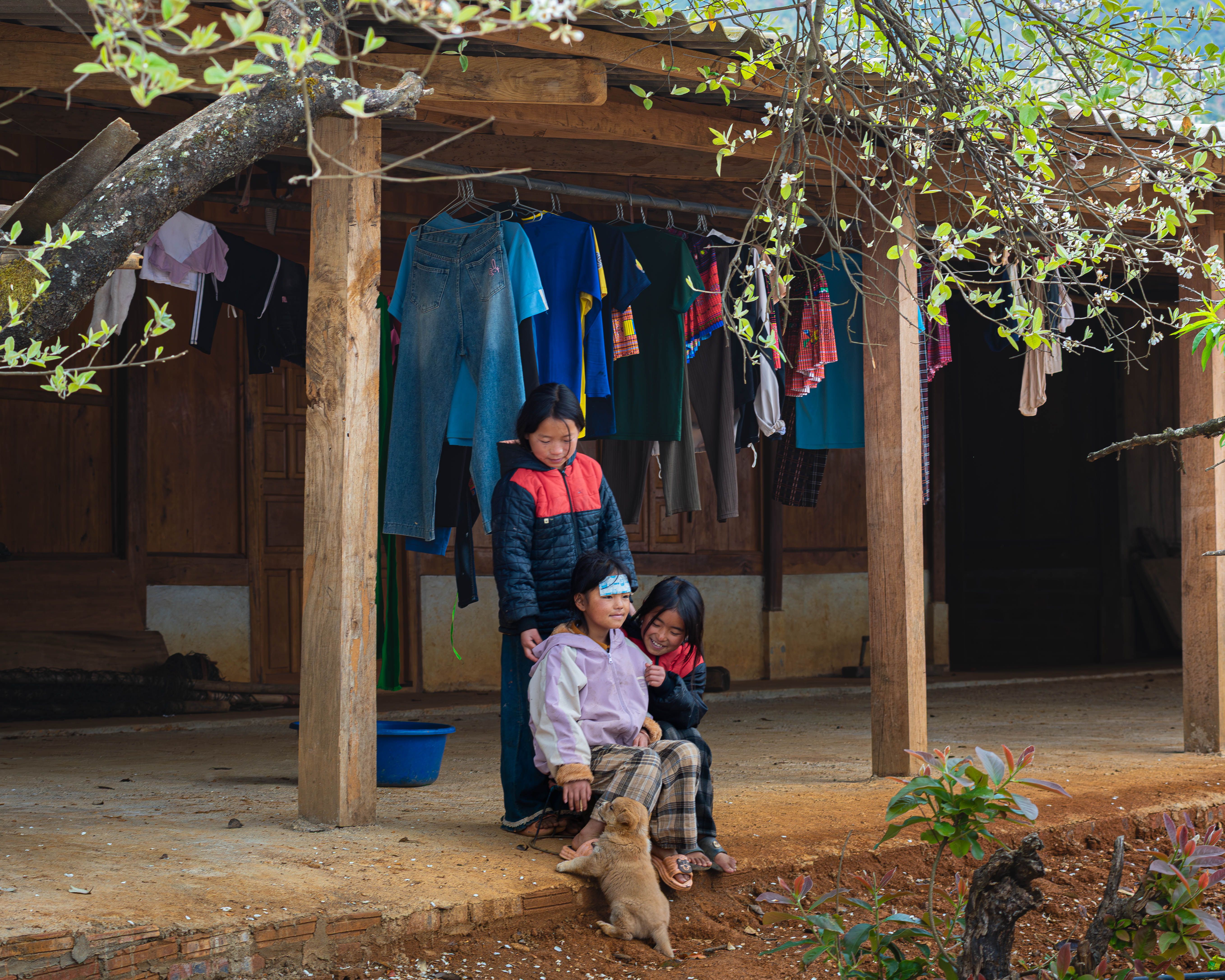 Children Playing in a Rustic Outdoor Setting · Free Stock Photo
