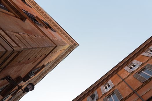A captivating perspective of historic Roman buildings against a clear sky.
