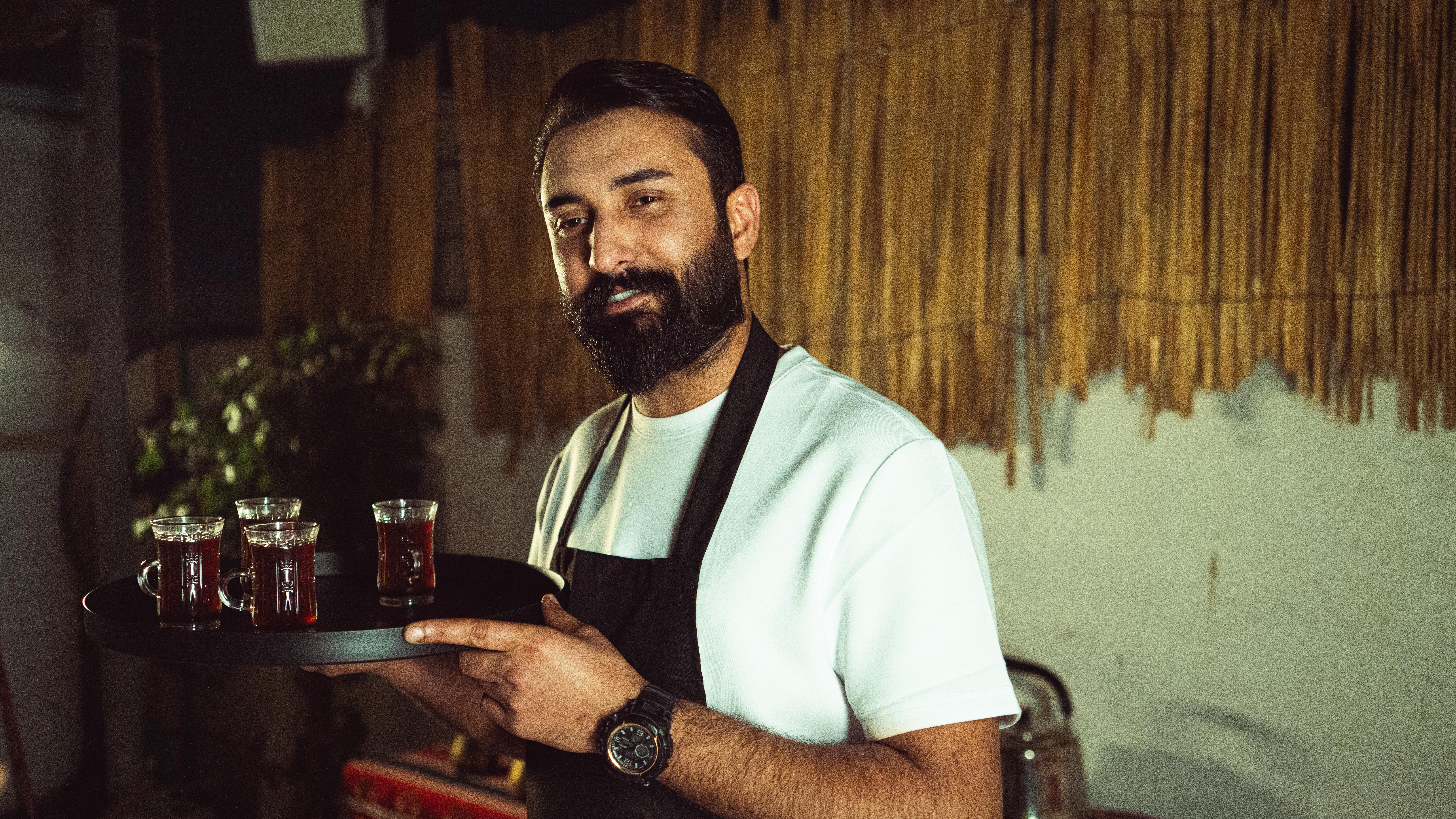 Restaurant owner beside host stand
