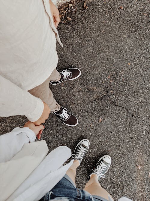 Free People in Black and White Sneakers Stock Photo