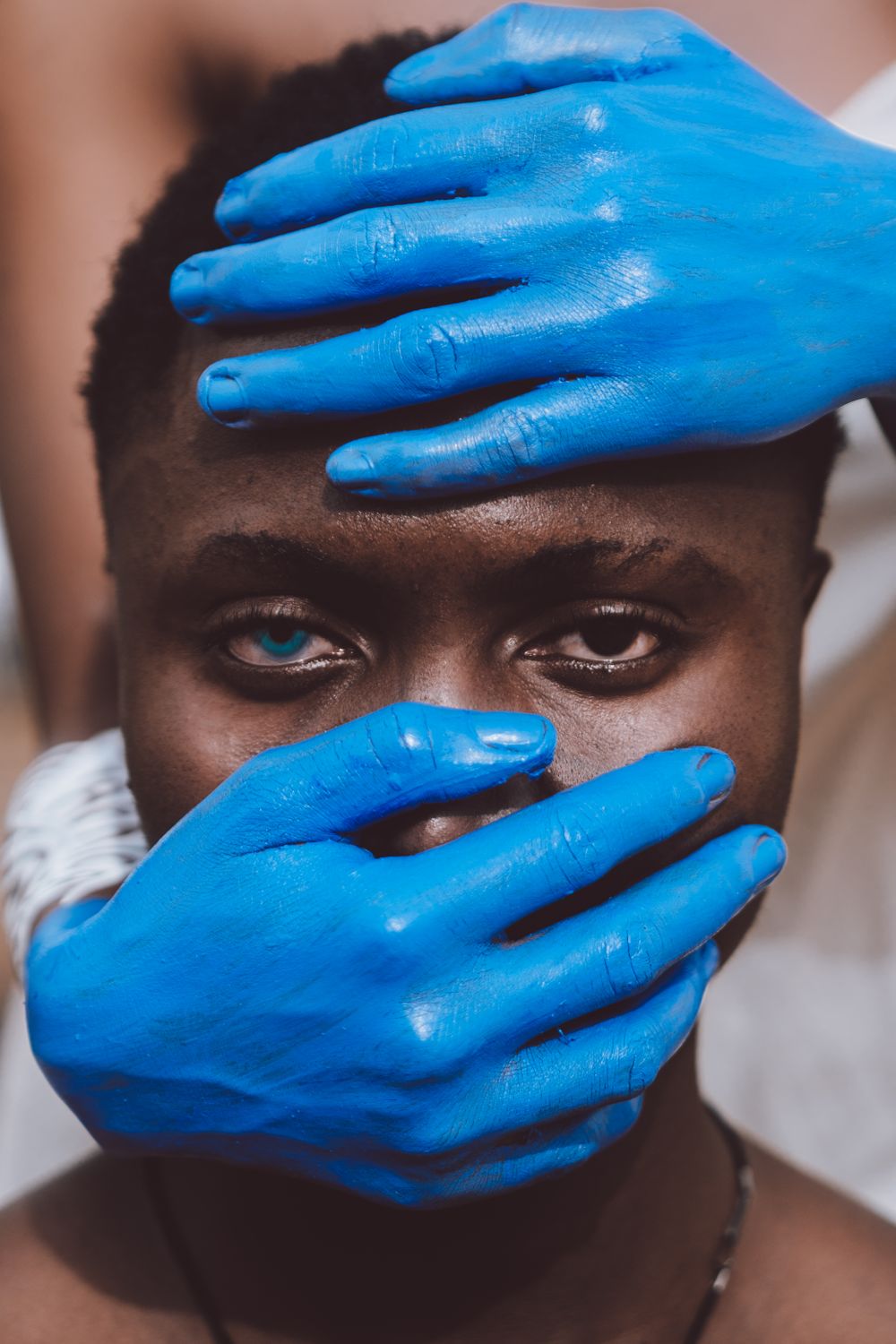 Artistic Portrait with Blue Painted Hands · Free Stock Photo