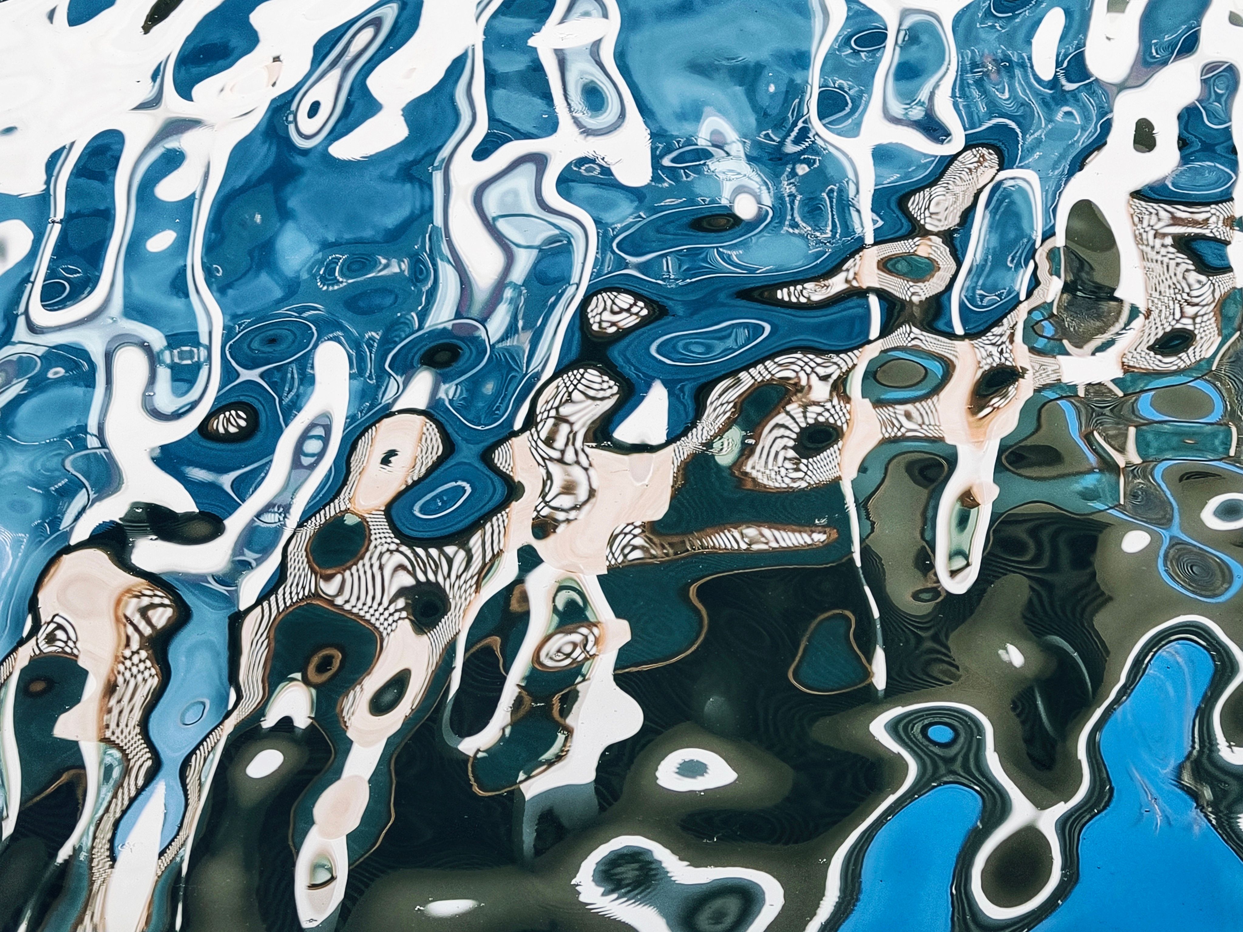 Abstract Water Reflection with Blue and White Patterns · Free Stock Photo