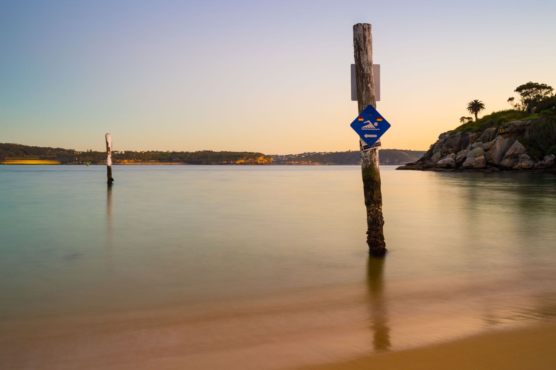 Tranquil evening view of Balmoral Beach in NSW Australia, capturing calm waters and vibrant sunset colors.