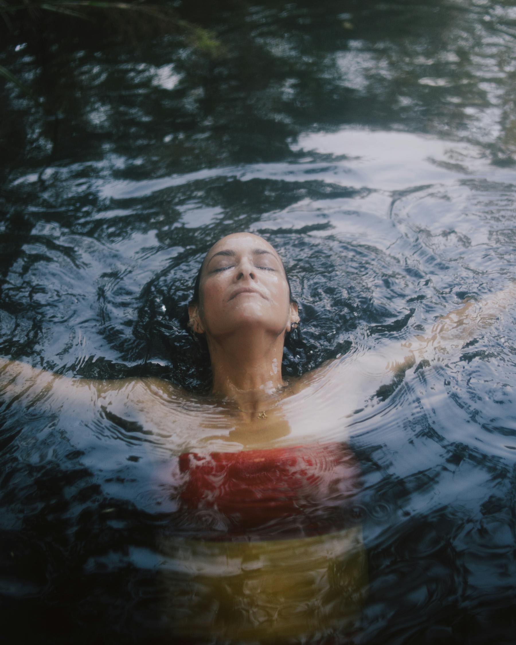 Woman in Red Tube Top in Swimming in water