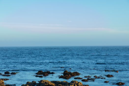 Captivating view of the rugged Monterey coastline meeting the expansive blue ocean.