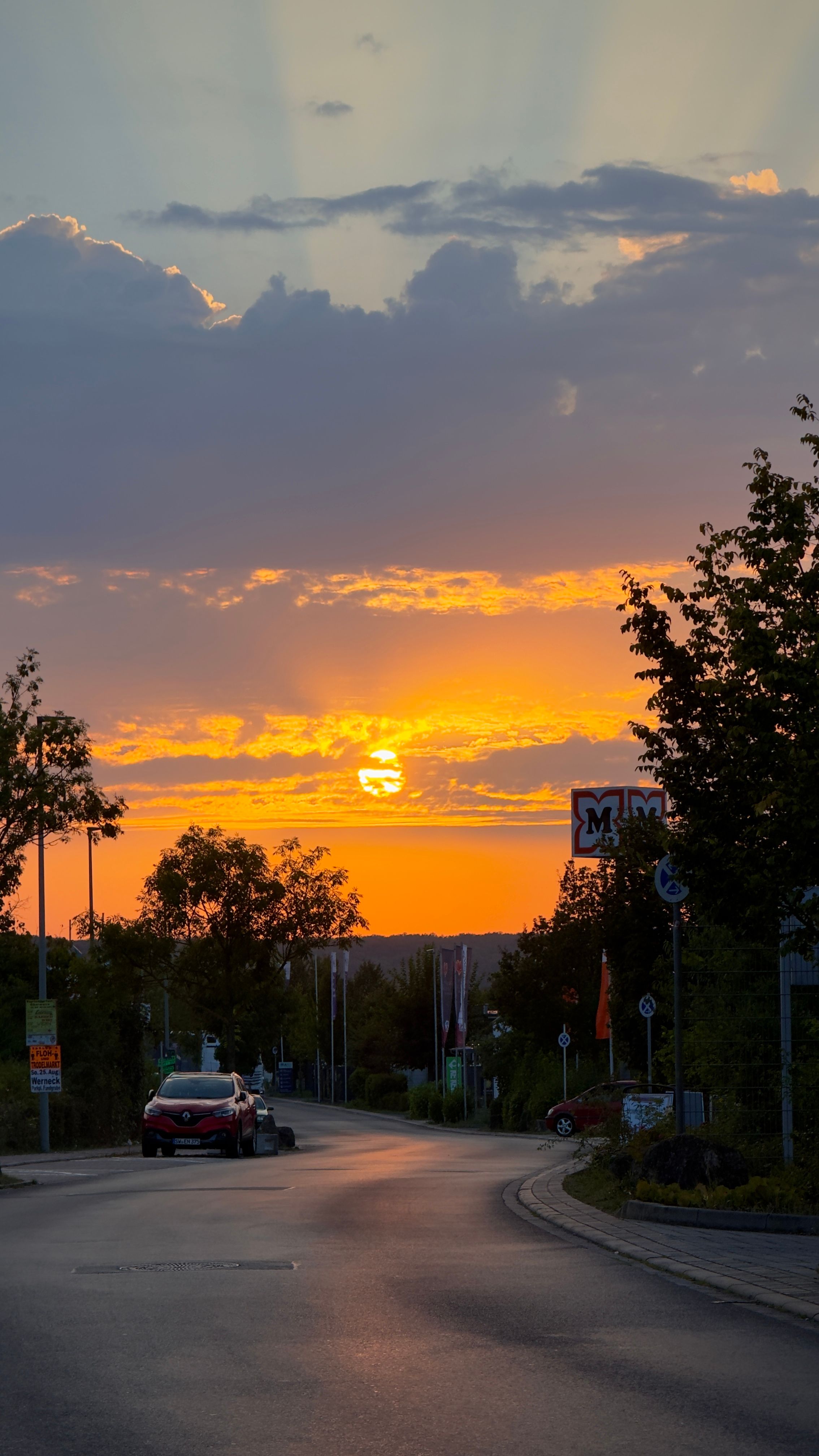 Dramatic Sunset Over a Quiet Neighborhood Street · Free Stock Photo