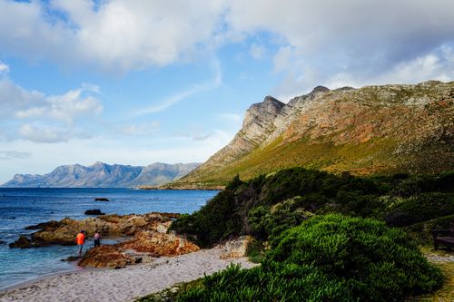 Free Scenic view of Kogelberg mountains meeting the ocean with vibrant flora in South Africa. Stock Photo