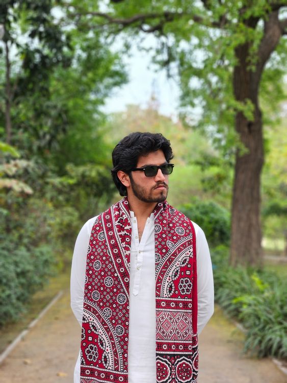 Man in Traditional Red and White Scarf Outdoors · Free Stock Photo