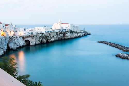 Free Beautiful seaside town of Vieste, Italy with a cliffside view and clear blue waters. Stock Photo