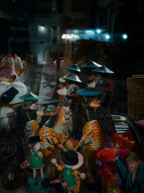Free A display of vibrant wooden animal figurines in a Sarajevo shop. Rich colors and unique designs capture attention. Stock Photo