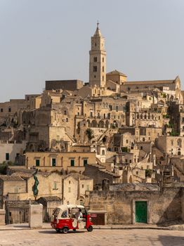 Discover the historic charm of Matera, Italy with its ancient stone buildings and scenic views.