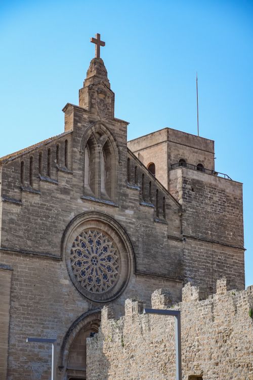 Free A historic church in Ibiza, Spain showcasing stunning Gothic architecture under a clear blue sky. Stock Photo