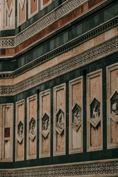 Free Close-up view of Florence Cathedral facade showcasing ornate geometric designs and carvings. Stock Photo