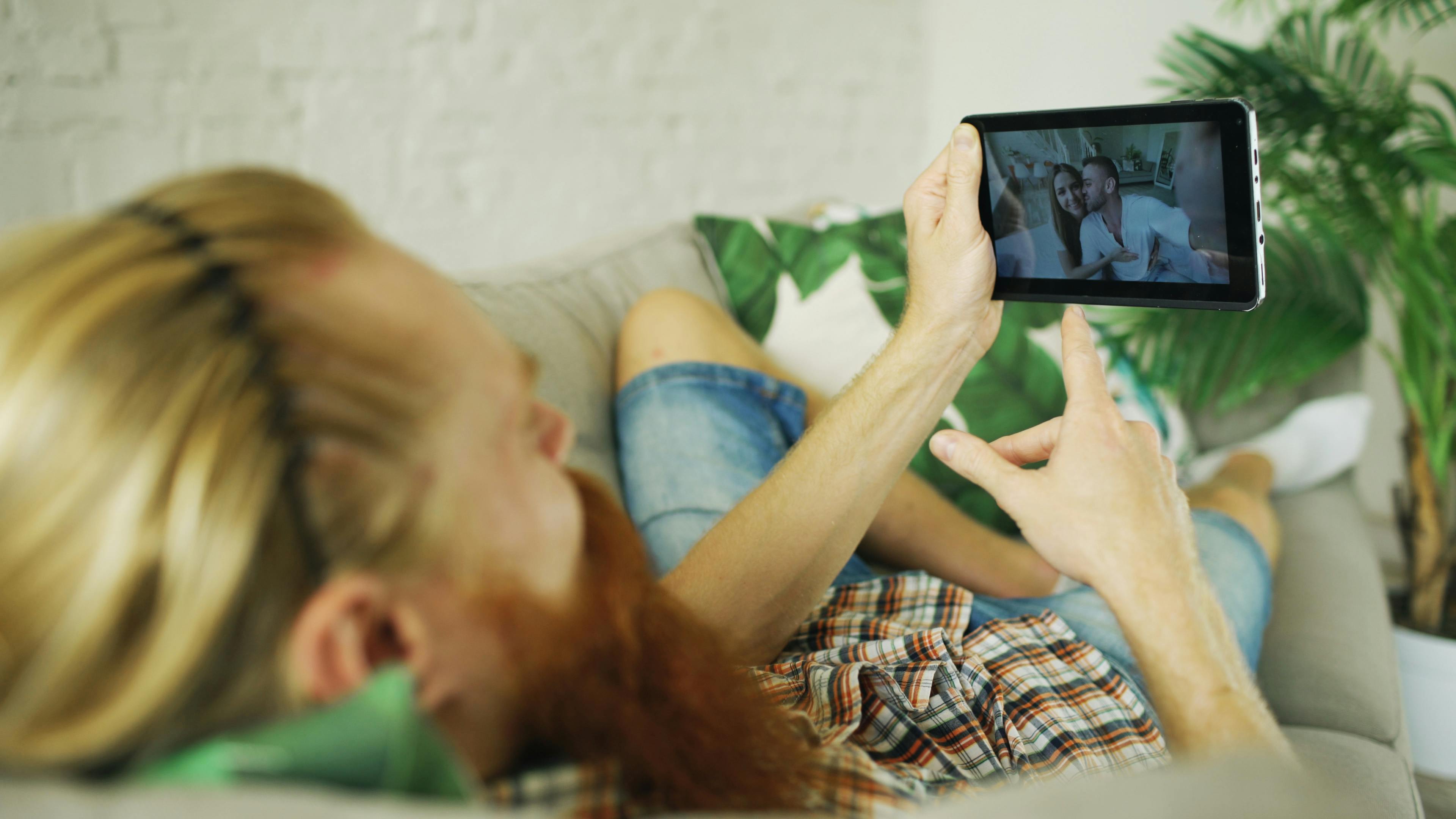 A person watching a video on a tablet