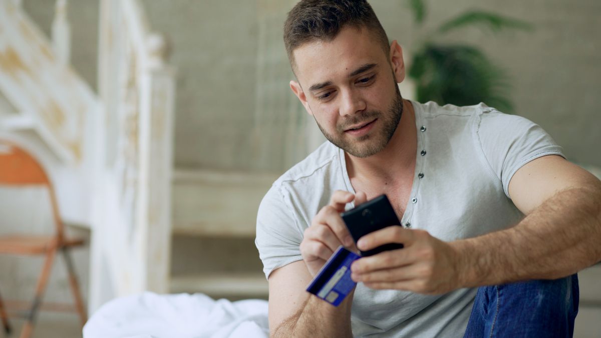 Tenant paying rent from his phone at home