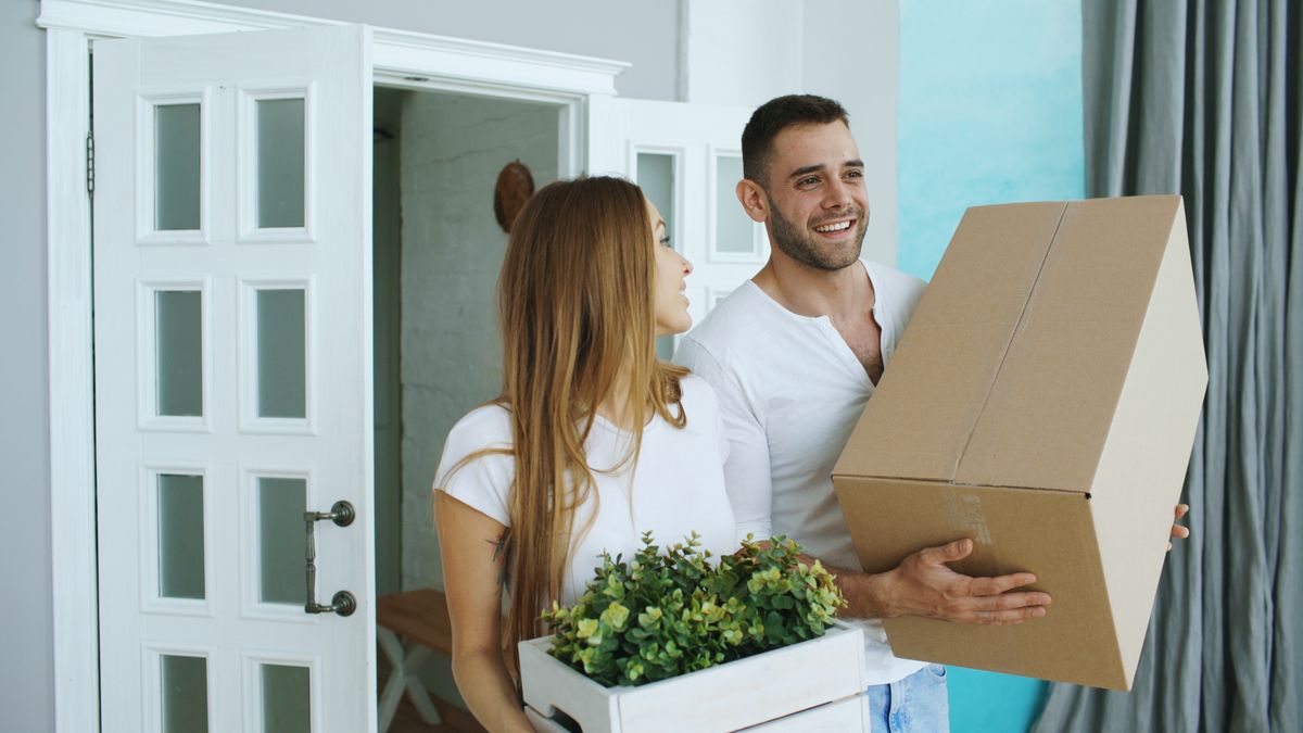 Military family moving boxes into a new Cibolo TX home near JBSA