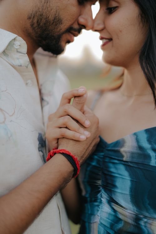 Romantic Couple Holding Hands Outdoors · Free Stock Photo