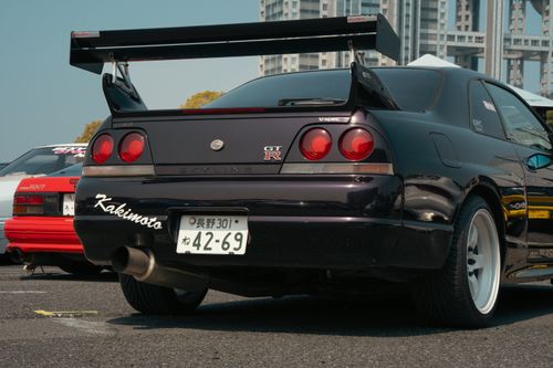 Free A vibrant shot of a Nissan Skyline GT-R at Tokyo car event, showcasing automotive culture. Stock Photo